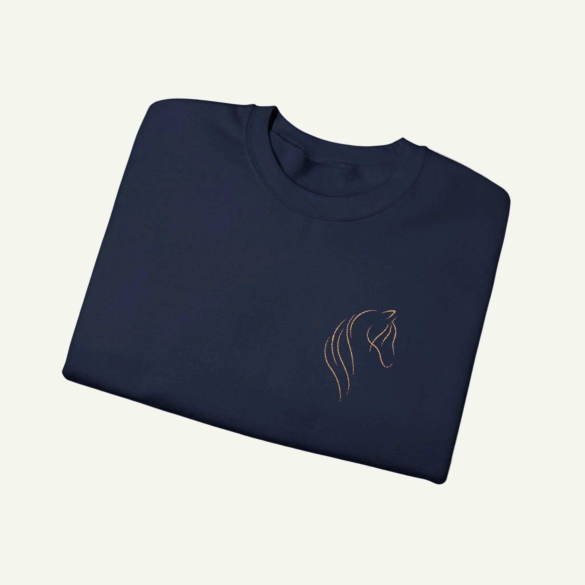 Folded navy blue shirt with a gold horse head logo on a white background
