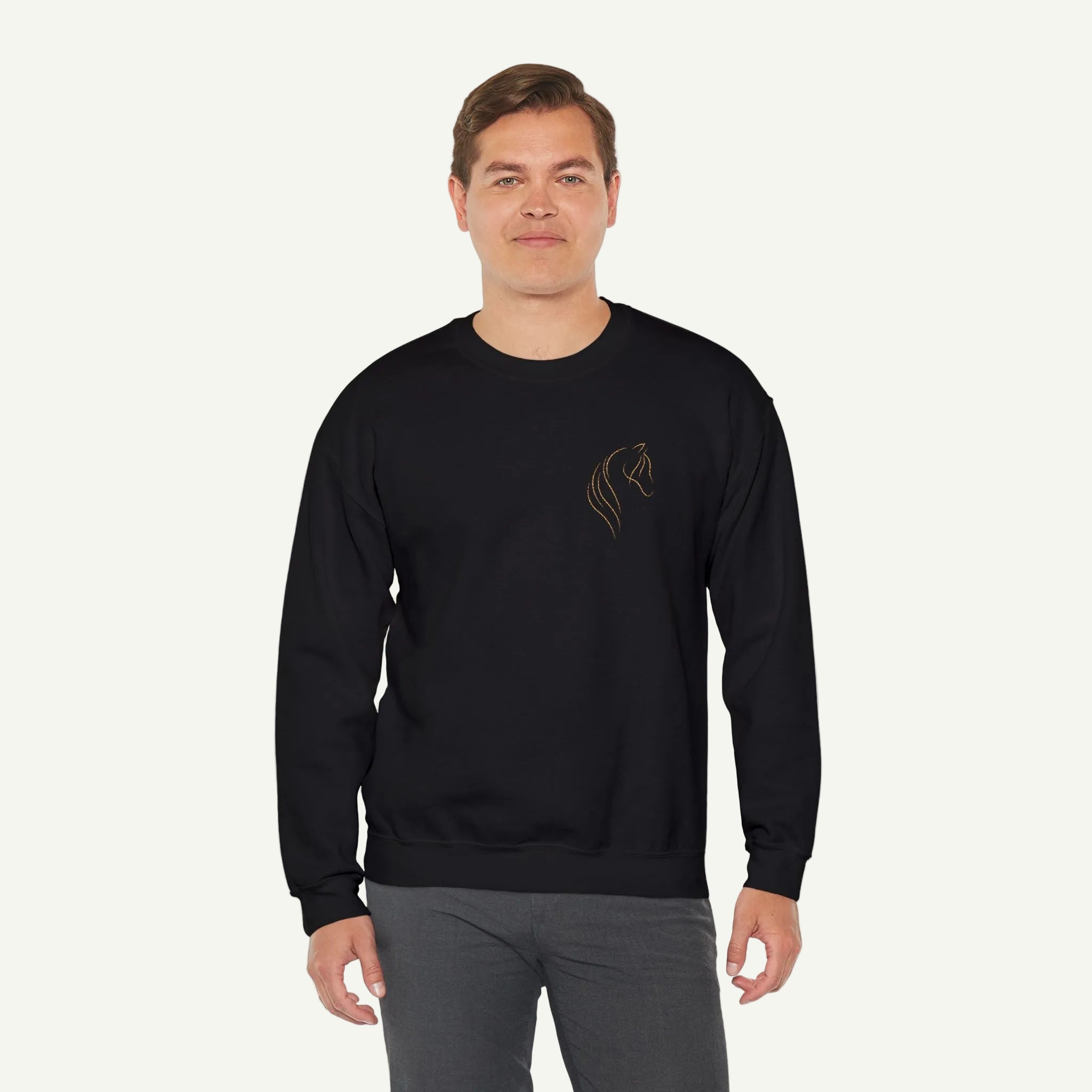 Man wearing a black sweatshirt with a logo on a white background