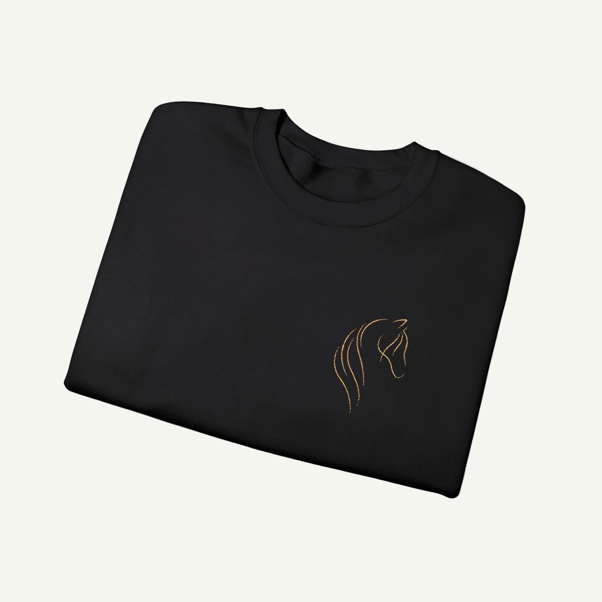 Folded black sweatshirt with a gold horse head logo on a white background