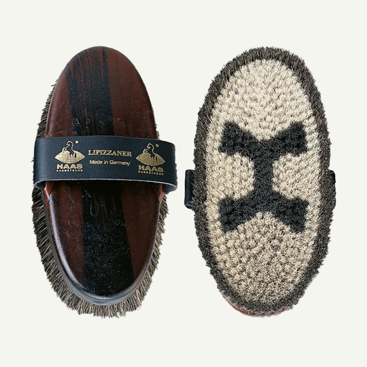 Horse brush with bristle head and wooden handle, branded 'Lipizzaner Naas'.