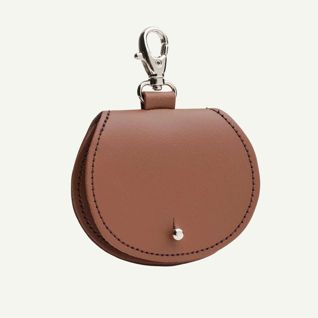 Brown leather keychain pouch with a clasp on a white background