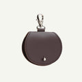Brown leather keychain pouch with a clasp on a white background