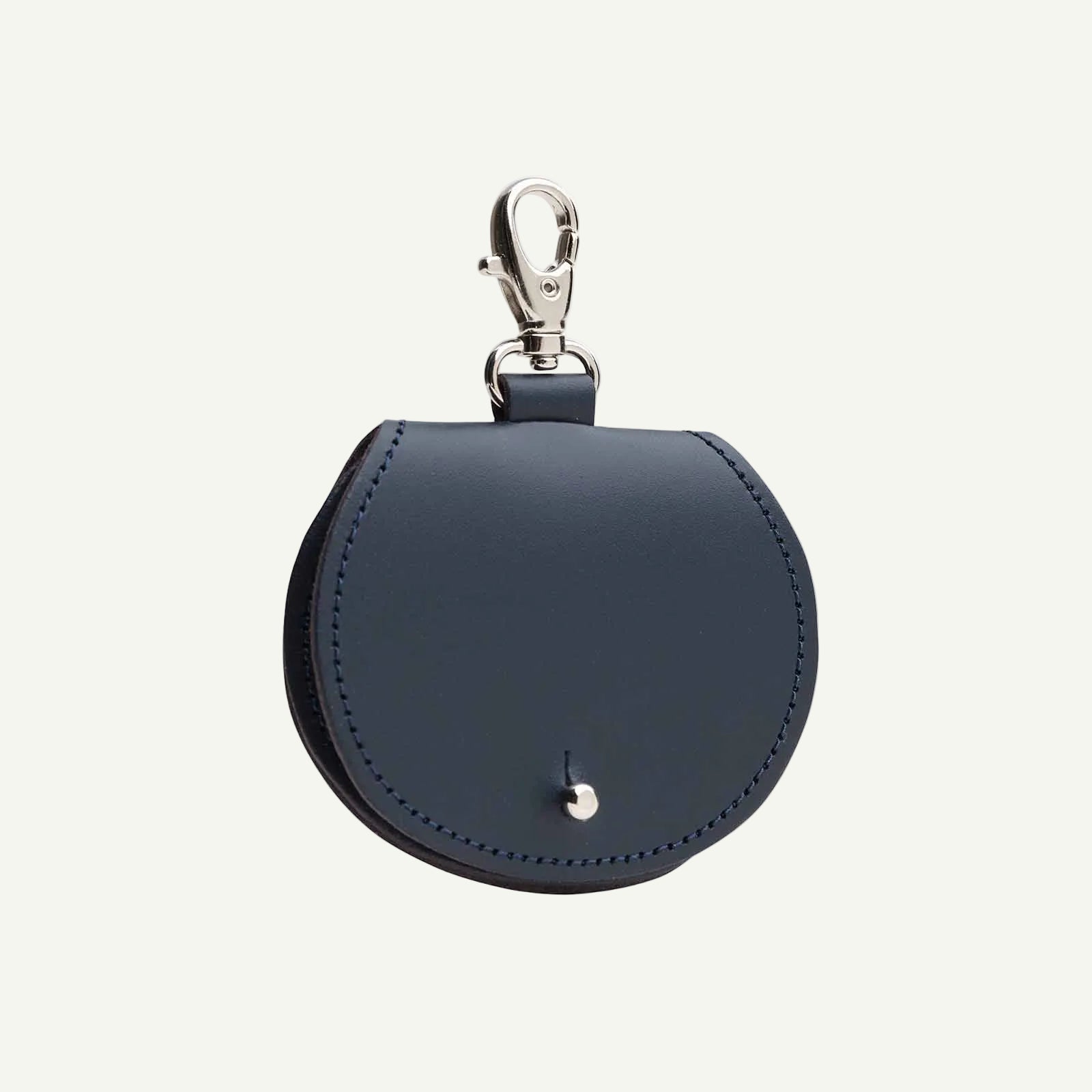 Navy blue leather keychain pouch with silver clasp on a white background