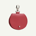 Red leather keychain pouch with a clasp on a white background