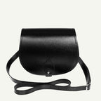 Black leather saddle bag on a white background