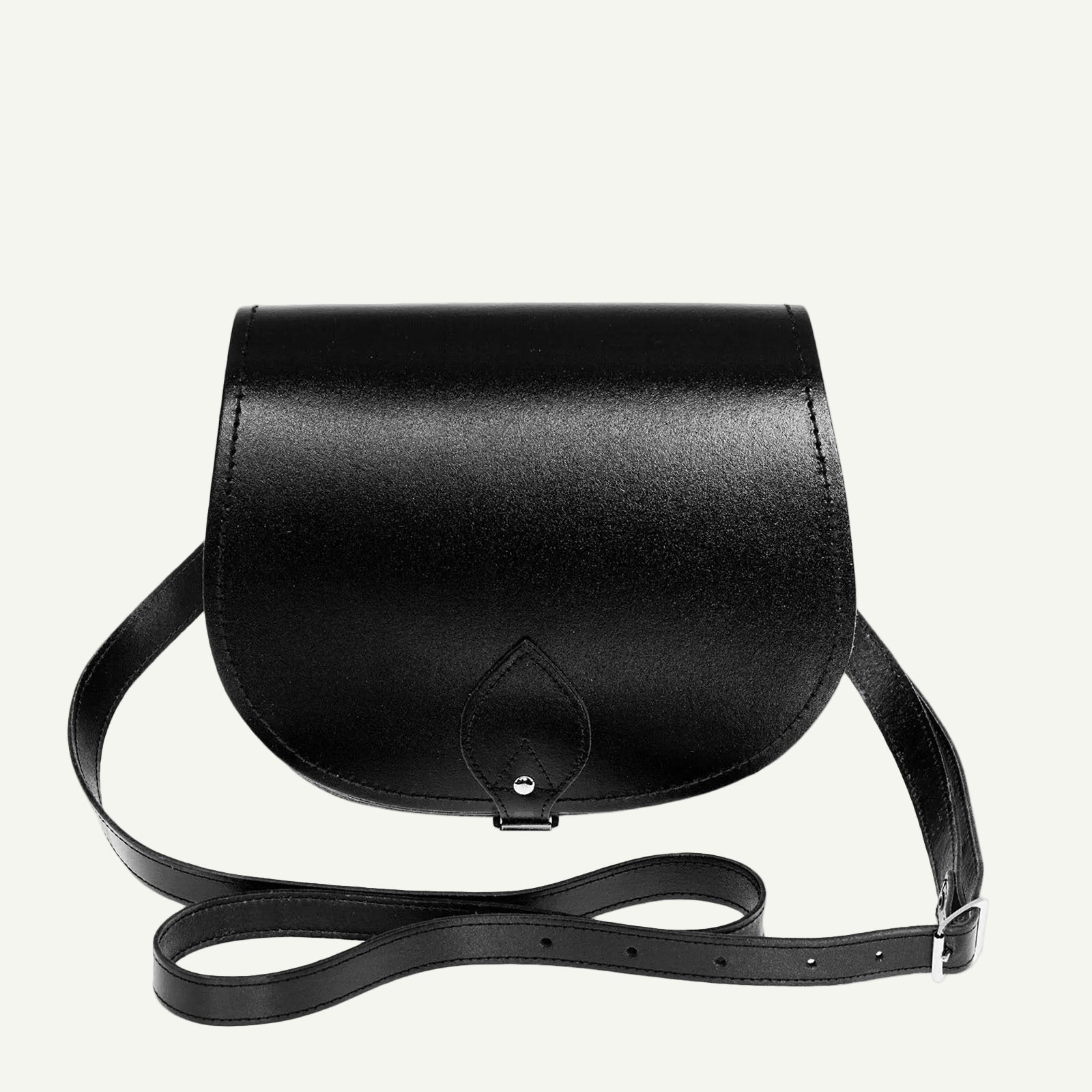 Black leather saddle bag on a white background