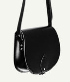 Black leather saddle bag on a white background