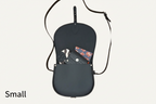 Small saddle bag with a black strap on a white background