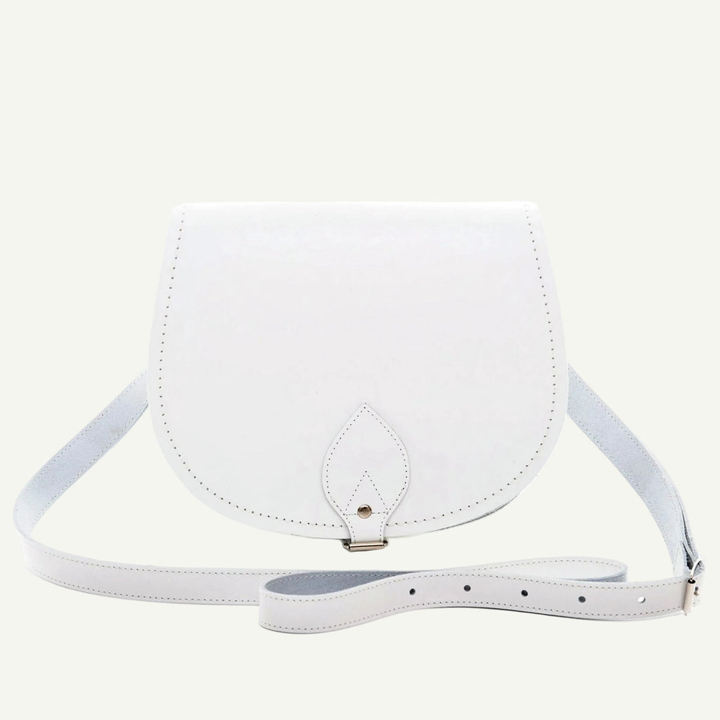 White leather crossbody bag on a white background