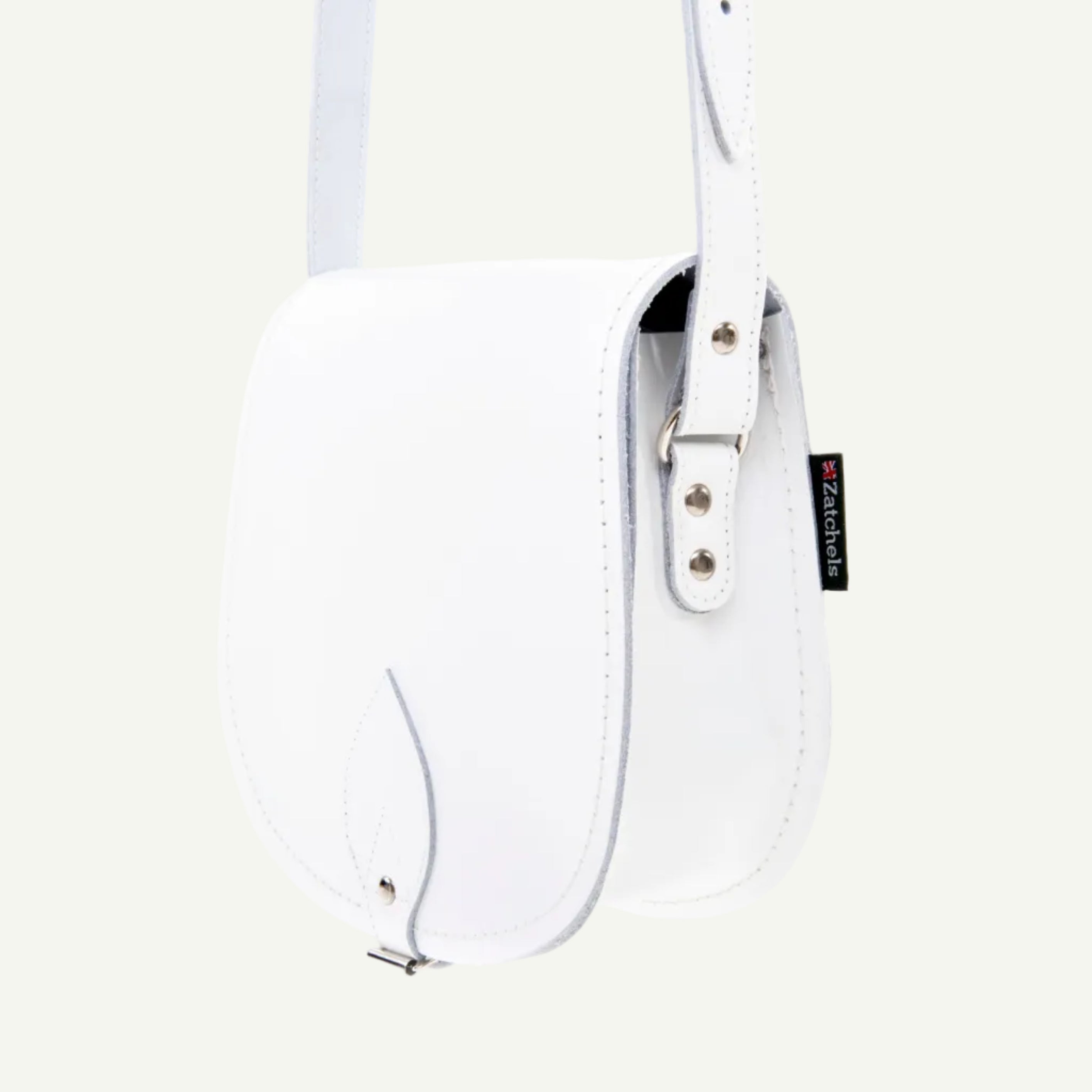 White handbag with a strap on a white background